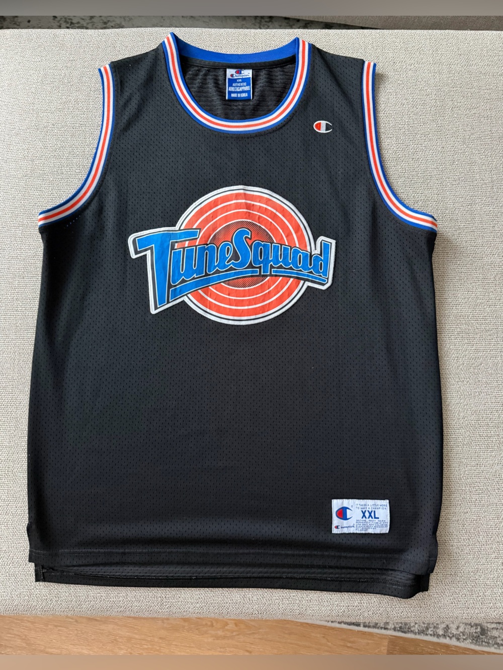 Champion Tune Squad Black Basketball Jersey with Blue and Red Accents
